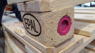 Close-up of a smart pallet with a Deutsche Telekom machine-to-machine module. Smart pallet with Deutsche Telekom module